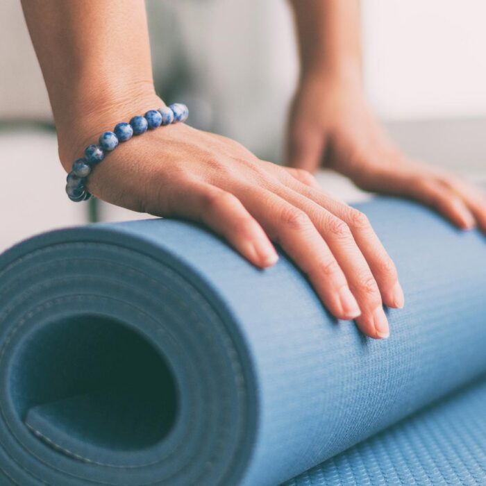 client rolling yoga matt