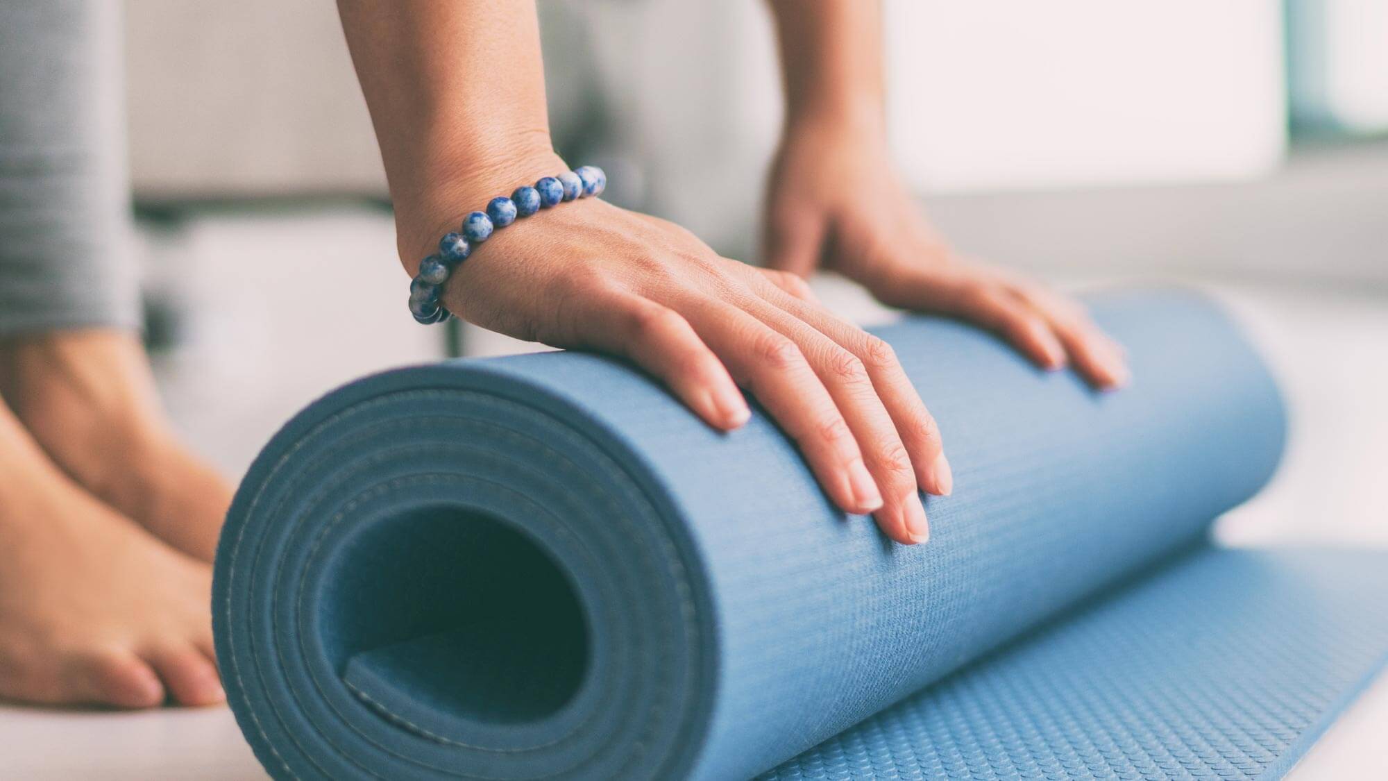 client rolling yoga matt